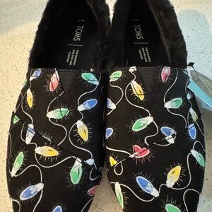 TOMS Holiday Lights Black Glow-in-the-Dark Slip-Ons, Women’s size 6.5 NWT